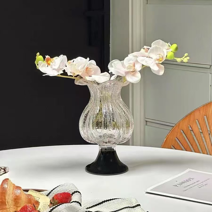 Various oddly shaped glass vases