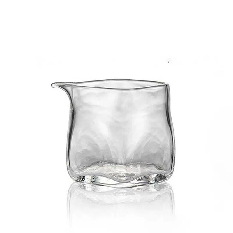 Japanese-style transparent square glass fairness pitcher with a hammered texture.